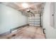 Garage featuring a concrete floor, an automatic door opener, and storage racks at 8739 Grassy Oak Trl, North Charleston, SC 29420