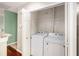 Laundry closet with a white washer and dryer inside the home at 8739 Grassy Oak Trl, North Charleston, SC 29420