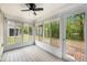 Bright sunroom with large windows offering views of the lush backyard at 8739 Grassy Oak Trl, North Charleston, SC 29420