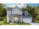 Charming two-story home with light blue siding, a covered porch, and a two-car garage on a well-manicured lawn at 88 French Garden Cir, Summerville, SC 29486