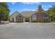 Community clubhouse exterior featuring a brick chimney and arched windows at 103 Ashley Villa Cir # D, Charleston, SC 29414