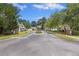 A gated community entrance with an American flag and well-maintained landscaping at 103 Ashley Villa Cir # D, Charleston, SC 29414
