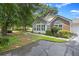 Charming home exterior with a combination of brick and siding, complemented by lush landscaping at 103 Ashley Villa Cir # D, Charleston, SC 29414