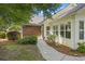 Inviting home exterior with well-maintained landscaping, brick accents, and a welcoming entrance at 103 Ashley Villa Cir # D, Charleston, SC 29414