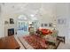 Comfortable living room featuring a fireplace, vaulted ceilings and seamless transition to the sunroom at 103 Ashley Villa Cir # D, Charleston, SC 29414