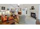 Spacious living room with fireplace, plush seating, and seamless flow into the adjacent kitchen at 103 Ashley Villa Cir # D, Charleston, SC 29414