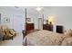 The main bedroom features a four-poster bed, neutral walls, ceiling fan and two dressers at 103 Ashley Villa Cir # D, Charleston, SC 29414