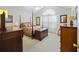 Spacious main bedroom with a four-poster bed, vaulted ceilings, and a neutral color palette at 103 Ashley Villa Cir # D, Charleston, SC 29414