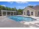 Community pool with ample lounge chairs and well-manicured landscaping in the background at 103 Ashley Villa Cir # D, Charleston, SC 29414