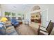 Bright sunroom featuring multiple windows, vaulted ceiling, and access to living room at 103 Ashley Villa Cir # D, Charleston, SC 29414