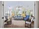 Inviting sunroom with ample natural light and comfortable seating, perfect for relaxation at 103 Ashley Villa Cir # D, Charleston, SC 29414