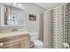 Bathroom with vanity and cabinet with a shower featuring a decorative curtain at 103 Greencastle Dr, Goose Creek, SC 29445