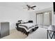 Bedroom with fan and sliding glass door, furnished with a bed, and shelving unit at 103 Greencastle Dr, Goose Creek, SC 29445