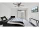 Bright bedroom with fan and sliding glass door, furnished with a bed and desk at 103 Greencastle Dr, Goose Creek, SC 29445