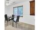 The dining area has four chairs, a modern table, a ceiling fan, and a mounted display cabinet at 103 Greencastle Dr, Goose Creek, SC 29445