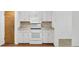 The kitchen has white cabinets, a laminate countertop, and modern appliances, providing a clean space at 103 Greencastle Dr, Goose Creek, SC 29445
