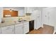 The kitchen has white cabinets, a dishwasher, a refrigerator, and neutral countertops at 103 Greencastle Dr, Goose Creek, SC 29445