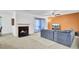 Cozy living room with fireplace, ceiling fan and comfortable seating area at 103 Greencastle Dr, Goose Creek, SC 29445