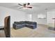 Spacious living room with neutral carpet and paint and L-shaped sectional sofa at 103 Greencastle Dr, Goose Creek, SC 29445