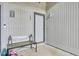 Inviting entryway with a cozy bench, decorative lanterns, and unit number 103 on the door at 103 Greencastle Dr, Goose Creek, SC 29445