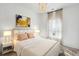 Cozy bedroom with a comfortable bed, stylish chandelier, bedside lamps, and neutral decor at 1044 Scotch Bonnet Way, Summerville, SC 29485
