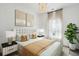 Elegantly furnished bedroom with a plush bed, complementary bedside tables, and a decorative chandelier at 1044 Scotch Bonnet Way, Summerville, SC 29485