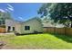 Spacious backyard with lush green grass and wood fence surrounding property at 108 Alston Cir, Goose Creek, SC 29445