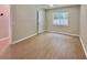 Empty bedroom with wood-look flooring, a window, and a closet at 108 Alston Cir, Goose Creek, SC 29445