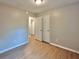 Bright bedroom with wood-look floors and access to a connected room at 108 Alston Cir, Goose Creek, SC 29445
