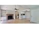Open-concept living room with a fireplace, built-in shelves, and bright lighting at 108 Alston Cir, Goose Creek, SC 29445