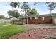 The backyard offers a cozy wooden deck and flower bed to enhance the charm of this brick home at 1105 Crull Dr, Charleston, SC 29407