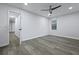 Bedroom featuring modern wood-look floors, ceiling fan, and a hallway leading to other rooms at 1105 Crull Dr, Charleston, SC 29407