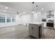 Open-concept kitchen featuring a stylish island, stainless steel appliances, and modern lighting at 1105 Crull Dr, Charleston, SC 29407
