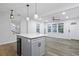 Open-concept kitchen and living room area with modern island and stainless steel appliances at 1105 Crull Dr, Charleston, SC 29407