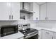 Close-up view of the kitchen featuring stainless steel appliances and white subway tile at 1105 Crull Dr, Charleston, SC 29407