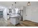 Modern kitchen with white cabinetry, stainless steel appliances, and an island with pendant lighting at 1105 Crull Dr, Charleston, SC 29407