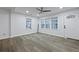 Bright living room featuring a front entry door and windows, offering ample natural light at 1105 Crull Dr, Charleston, SC 29407