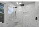 Luxurious tiled shower with rainfall showerhead, glass enclosure, and a built-in bench for relaxation at 1105 Crull Dr, Charleston, SC 29407