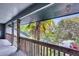 View from a private balcony showcasing a tropical tree and surrounding neighborhood at 1120 Hidden Cove Dr # I, Mount Pleasant, SC 29464
