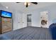 Relaxing bedroom features a tv, ceiling fan, and access to a bathroom and the upstairs landing at 1120 Hidden Cove Dr # I, Mount Pleasant, SC 29464