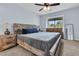 Comfortable bedroom featuring wood furniture, neutral carpet and a large window at 1120 Hidden Cove Dr # I, Mount Pleasant, SC 29464