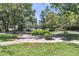 Relaxing community green space featuring mature trees, benches, and well-maintained landscaping at 1120 Hidden Cove Dr # I, Mount Pleasant, SC 29464