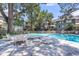 Community pool with lounge chairs, shade trees, and ladder for easy access at 1120 Hidden Cove Dr # I, Mount Pleasant, SC 29464