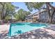 Inviting community pool surrounded by lounge chairs, lush trees, and well-maintained landscaping at 1120 Hidden Cove Dr # I, Mount Pleasant, SC 29464