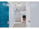 Bright entryway featuring tile floors, stairs, and a vibrant blue front door at 1120 Hidden Cove Dr # I, Mount Pleasant, SC 29464
