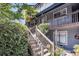 The home features beautiful stairs with greenery. Palm trees in the yard at 1120 Hidden Cove Dr # I, Mount Pleasant, SC 29464