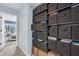 Hallway with lots of shelving for storage, and a view into another room with a view of the outdoors at 1120 Hidden Cove Dr # I, Mount Pleasant, SC 29464