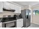 Functional kitchen with stainless steel appliances, white cabinets, and durable countertops at 1120 Hidden Cove Dr # I, Mount Pleasant, SC 29464