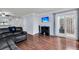 Bright living room with hardwood floors, access to patio, and tv mounted on the wall at 1120 Hidden Cove Dr # I, Mount Pleasant, SC 29464