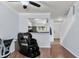Open-concept living area with hardwood floors, a view of the kitchen, and abundant natural light at 1120 Hidden Cove Dr # I, Mount Pleasant, SC 29464